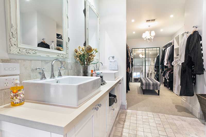 Stylish master bathroom with twin sinks and spacious walk in robe